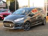 USED 2017 17 FORD FIESTA 1.0 ST-LINE 3d 124 BHP Finished in MAGNETIC METALLIC with contrasting GREY SPORTS Cloth interior trim. This Fiesta is a small car that you can really enjoy driving. Economical and cheap to run, stylish to look at and some great features. Specification includes Sat Nav, DAB radio, B/Tooth, 17" Alloys, Heated Front Screen, Air Con and much more. This is a must for the first time driver or small family. Ford Dealer Serviced at 12225 miles, 23041 miles and on arrival by EMC at 41648 miles.