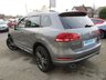 USED 2013 63 VOLKSWAGEN TOUAREG 3.0 V6 R-LINE TDI BLUEMOTION TECHNOLOGY 5d 242 BHP Finished in CANYON GREY Metallic with contrasting HEATED EBONY LEATHER TRIM. This is a luxurious family car that is as good off road as it is on. It is spacious, comfortable and great to drive. Features include Sat Nav, Pan Roof, B/Tooth, Park sensors, Heated Leather, DAB, 20" Alloys and much more. Dealer Serviced at 15717 miles, 25550 miles, 39001 miles, and at 46416 miles.