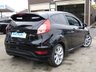 USED 2013 63 FORD FIESTA 1.0 ZETEC S 3d 124 BHP Finished in SHADOW BLACK with contrasting GREY SPORTS Cloth interior trim. This Fiesta is a small car that you can really enjoy driving. Economical and cheap to run, stylish to look at and some great features including ZERO Road Tax, B/Tooth, 17"Alloys, Air Con and much more, makes this a must for the first time driver or small family. Dealer Serviced at 6540 miles, 19893 miles, 29668 miles, 32603 miles, 51402 miles, 65332 miles and on arrival at 77841 miles. . 12 Months MOT.
