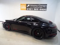 USED 2019 19 PORSCHE 911 3.0 CARRERA 4S PDK 2d 444 BHP THIS AMAZING ONE OWNER  SPORTS CAR COMES IN GLEAMING DEEP BLACK IT HAS ONLY COVERED 7800 MILES AND COMES IN PERFECT CONDITION, THFE 3.0L TWIN TURBO CHARED FLAT SIX PRODUCES A BREATHTAKING  444BHP LINKED TO THE ROAD BY AN AMAZING 4WD DRIVE SYSTEM. THE CAR HAS AN AMAZING SETOF FEATURES INCLUDING STUNNING GLOSS BLACK 20/21" ALLOY WHEELS,  WITH HEATED ELECTRIC ADJUST PERFORATED LEATHER SPORT SEATSCONTRASTING STITCHING AND HEADREST LOGOS, BRILLIANT 10.9 INCH FULL-COLOUR SAT NAV + MEDIA CENTRE WITH SA