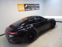 USED 2019 19 PORSCHE 911 3.0 CARRERA 4S PDK 2d 444 BHP THIS AMAZING ONE OWNER  SPORTS CAR COMES IN GLEAMING DEEP BLACK IT HAS ONLY COVERED 7800 MILES AND COMES IN PERFECT CONDITION, THFE 3.0L TWIN TURBO CHARED FLAT SIX PRODUCES A BREATHTAKING  444BHP LINKED TO THE ROAD BY AN AMAZING 4WD DRIVE SYSTEM. THE CAR HAS AN AMAZING SETOF FEATURES INCLUDING STUNNING GLOSS BLACK 20/21" ALLOY WHEELS,  WITH HEATED ELECTRIC ADJUST PERFORATED LEATHER SPORT SEATSCONTRASTING STITCHING AND HEADREST LOGOS, BRILLIANT 10.9 INCH FULL-COLOUR SAT NAV + MEDIA CENTRE WITH SA