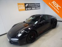 USED 2019 19 PORSCHE 911 3.0 CARRERA 4S PDK 2d 444 BHP THIS AMAZING ONE OWNER  SPORTS CAR COMES IN GLEAMING DEEP BLACK IT HAS ONLY COVERED 7800 MILES AND COMES IN PERFECT CONDITION, THFE 3.0L TWIN TURBO CHARED FLAT SIX PRODUCES A BREATHTAKING  444BHP LINKED TO THE ROAD BY AN AMAZING 4WD DRIVE SYSTEM. THE CAR HAS AN AMAZING SETOF FEATURES INCLUDING STUNNING GLOSS BLACK 20/21" ALLOY WHEELS,  WITH HEATED ELECTRIC ADJUST PERFORATED LEATHER SPORT SEATSCONTRASTING STITCHING AND HEADREST LOGOS, BRILLIANT 10.9 INCH FULL-COLOUR SAT NAV + MEDIA CENTRE WITH SA