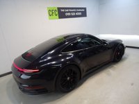 USED 2019 19 PORSCHE 911 3.0 CARRERA 4S PDK 2d 444 BHP THIS AMAZING ONE OWNER  SPORTS CAR COMES IN GLEAMING DEEP BLACK IT HAS ONLY COVERED 7800 MILES AND COMES IN PERFECT CONDITION, THE 3.0L TWIN TURBO CHARED FLAT SIX PRODUCES A BREATHTAKING  444BHP LINKED TO THE ROAD BY AN AMAZING 4WD DRIVE SYSTEM. THE CAR HAS AN AMAZING SET OF FEATURES INCLUDING STUNNING GLOSS BLACK 20/21" ALLOY WHEELS, HEATED ELECTRIC ADJUST PERFORATED LEATHER SPORT SEATS WITH CONTRASTING STITCHING AND HEADREST LOGOS, BRILLIANT 10.9 INCH FULL-COLOUR SAT NAV + MEDIA CENTRE WITH SA
