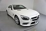 USED 2013 63 MERCEDES-BENZ SL 3.5 SL350 2d 306 BHP-DIAMOND WHITE METALLIC-HEATED RED LEATHER-ACTIVE PARK ASSIST-SPORTS STEERING WHEEL-CLIMATE CONTROL-CRUISE CONTROL-AIRSCARF SYSTEM AT FRONT-GLASS ROOF-SPORTS SUSPENSION-COMAND APS WITH DVD CHANGER-AMG 19