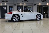 USED 2012 62 PORSCHE BOXSTER 3.4 24V S PDK 2d AUTO 315 BHP FINISHED IN STUNNING WHITE, WITH BEAUTIFULLY CONTRASTING RED ROOF AND FULL RED LEATHER SPORTS SEATS AND UPHOLSTERY + THOUSANDS OF POUNDS OF ADDITIONAL SPECIFICATION + IMPECCABLE SERVICED AND COMES WITH A FULLY DOCUMENTED PORSCHE SERVICE HISTORY + SATELLITE NAVIGATION + PDK DUAL CLUTCH AUTO +  BLUETOOTH CONNECTIVITY + SPORT EXHAUST SYSTEM + BOSE SURROUND SOUND SPEAKER SYSTEM + PORSCHE COMMUNICATION MANAGEMENT + 2-ZONE CLIMATE CONTROL + AUTOMATIC XENON HEADLIGHTS + CRUISE CONTROL + ECO STOP/START