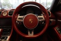 USED 2012 62 PORSCHE BOXSTER 3.4 24V S PDK 2d AUTO 315 BHP FINISHED IN STUNNING WHITE, WITH BEAUTIFULLY CONTRASTING RED ROOF AND FULL RED LEATHER SPORTS SEATS AND UPHOLSTERY + THOUSANDS OF POUNDS OF ADDITIONAL SPECIFICATION + IMPECCABLE SERVICED AND COMES WITH A FULLY DOCUMENTED PORSCHE SERVICE HISTORY + SATELLITE NAVIGATION + PDK DUAL CLUTCH AUTO +  BLUETOOTH CONNECTIVITY + SPORT EXHAUST SYSTEM + BOSE SURROUND SOUND SPEAKER SYSTEM + PORSCHE COMMUNICATION MANAGEMENT + 2-ZONE CLIMATE CONTROL + AUTOMATIC XENON HEADLIGHTS + CRUISE CONTROL + ECO STOP/START