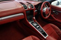 USED 2012 62 PORSCHE BOXSTER 3.4 24V S PDK 2d AUTO 315 BHP FINISHED IN STUNNING WHITE, WITH BEAUTIFULLY CONTRASTING RED ROOF AND FULL RED LEATHER SPORTS SEATS AND UPHOLSTERY + THOUSANDS OF POUNDS OF ADDITIONAL SPECIFICATION + IMPECCABLE SERVICED AND COMES WITH A FULLY DOCUMENTED PORSCHE SERVICE HISTORY + SATELLITE NAVIGATION + PDK DUAL CLUTCH AUTO +  BLUETOOTH CONNECTIVITY + SPORT EXHAUST SYSTEM + BOSE SURROUND SOUND SPEAKER SYSTEM + PORSCHE COMMUNICATION MANAGEMENT + 2-ZONE CLIMATE CONTROL + AUTOMATIC XENON HEADLIGHTS + CRUISE CONTROL + ECO STOP/START