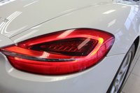 USED 2012 62 PORSCHE BOXSTER 3.4 24V S PDK 2d AUTO 315 BHP FINISHED IN STUNNING WHITE, WITH BEAUTIFULLY CONTRASTING RED ROOF AND FULL RED LEATHER SPORTS SEATS AND UPHOLSTERY + THOUSANDS OF POUNDS OF ADDITIONAL SPECIFICATION + IMPECCABLE SERVICED AND COMES WITH A FULLY DOCUMENTED PORSCHE SERVICE HISTORY + SATELLITE NAVIGATION + PDK DUAL CLUTCH AUTO +  BLUETOOTH CONNECTIVITY + SPORT EXHAUST SYSTEM + BOSE SURROUND SOUND SPEAKER SYSTEM + PORSCHE COMMUNICATION MANAGEMENT + 2-ZONE CLIMATE CONTROL + AUTOMATIC XENON HEADLIGHTS + CRUISE CONTROL + ECO STOP/START