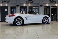 USED 2012 62 PORSCHE BOXSTER 3.4 24V S PDK 2d AUTO 315 BHP FINISHED IN STUNNING WHITE, WITH BEAUTIFULLY CONTRASTING RED ROOF AND FULL RED LEATHER SPORTS SEATS AND UPHOLSTERY + THOUSANDS OF POUNDS OF ADDITIONAL SPECIFICATION + IMPECCABLE SERVICED AND COMES WITH A FULLY DOCUMENTED PORSCHE SERVICE HISTORY + SATELLITE NAVIGATION + PDK DUAL CLUTCH AUTO +  BLUETOOTH CONNECTIVITY + SPORT EXHAUST SYSTEM + BOSE SURROUND SOUND SPEAKER SYSTEM + PORSCHE COMMUNICATION MANAGEMENT + 2-ZONE CLIMATE CONTROL + AUTOMATIC XENON HEADLIGHTS + CRUISE CONTROL + ECO STOP/START