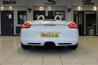 USED 2012 62 PORSCHE BOXSTER 3.4 24V S PDK 2d AUTO 315 BHP FINISHED IN STUNNING WHITE, WITH BEAUTIFULLY CONTRASTING RED ROOF AND FULL RED LEATHER SPORTS SEATS AND UPHOLSTERY + THOUSANDS OF POUNDS OF ADDITIONAL SPECIFICATION + IMPECCABLE SERVICED AND COMES WITH A FULLY DOCUMENTED PORSCHE SERVICE HISTORY + SATELLITE NAVIGATION + PDK DUAL CLUTCH AUTO +  BLUETOOTH CONNECTIVITY + SPORT EXHAUST SYSTEM + BOSE SURROUND SOUND SPEAKER SYSTEM + PORSCHE COMMUNICATION MANAGEMENT + 2-ZONE CLIMATE CONTROL + AUTOMATIC XENON HEADLIGHTS + CRUISE CONTROL + ECO STOP/START