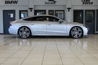 USED 2019 19 AUDI A7 3.0 SPORTBACK TDI QUATTRO S LINE 5d AUTO 282 BHP FINISHED IN A STUNNING METALLIC SILVER, COMPLIMENTED WITH BLACK HEATED HALF LEATHER AND SUEDE SEATS WITH ELECTRIC ADJUSTMENT AND MEMORY PROGRAMME + 1 OWNER FROM NEW, COMES WITH A FULL AUDI SERVICE HISTORY AND THE BALANCE OF AUDI'S MANUFACTURERS WARRANTY UNTIL MARCH 2022 + A SIMPLY OUTSTANDING EXAMPLE + AUDI VIRTUAL COCKPIT DIGITAL DASH DISPLAY +  MMI NAV PLUS SATELLITE NAVIGATION + REVERSE CAMERA + APPLE CARPLAY AND ANDROID AUTO + AUTOMATIC BI XENON HEADLIGHTS + 21 INCH ALLOY WHEELS