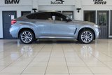 USED 2018 68 BMW X6 3.0 XDRIVE30D M SPORT 4d AUTO 255 BHP FINISHED IN STUNNING METALLIC GREY WITH ELECTRICALLY ADJUSTABLE FULL BLACK LEATHER HEATED SEATS WITH MEMORY PACK PLUS LUMBAR SUPPORT + 1 OWNER FROM NEW WITH A FULLY DOCUMENTED BMW MAIN DEALER SERVICE HISTORY AND THE BALANCE OF BMW'S MANUFACTURERS WARRANTY UNTIL OCTOBER 2021 + PROFESSIONAL SATELLITE NAVIGATION AND MEDIA + DRIVING ASSISTANT + DAB DIGITAL RADIO + BLUETOOTH MEDIA + HARMON KARDON SURROUND SOUND SYSTEM + HEATED FRONT AND REAR SEATS + HEAD UP DISPLAY + VOICE COMMAND + 360 VIEW CAMERA