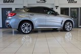 USED 2018 68 BMW X6 3.0 XDRIVE30D M SPORT 4d AUTO 255 BHP FINISHED IN STUNNING METALLIC GREY WITH ELECTRICALLY ADJUSTABLE FULL BLACK LEATHER HEATED SEATS WITH MEMORY PACK PLUS LUMBAR SUPPORT + 1 OWNER FROM NEW WITH A FULLY DOCUMENTED BMW MAIN DEALER SERVICE HISTORY AND THE BALANCE OF BMW'S MANUFACTURERS WARRANTY UNTIL OCTOBER 2021 + PROFESSIONAL SATELLITE NAVIGATION AND MEDIA + DRIVING ASSISTANT + DAB DIGITAL RADIO + BLUETOOTH MEDIA + HARMON KARDON SURROUND SOUND SYSTEM + HEATED FRONT AND REAR SEATS + HEAD UP DISPLAY + VOICE COMMAND + 360 VIEW CAMERA