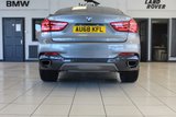 USED 2018 68 BMW X6 3.0 XDRIVE30D M SPORT 4d AUTO 255 BHP FINISHED IN STUNNING METALLIC GREY WITH ELECTRICALLY ADJUSTABLE FULL BLACK LEATHER HEATED SEATS WITH MEMORY PACK PLUS LUMBAR SUPPORT + 1 OWNER FROM NEW WITH A FULLY DOCUMENTED BMW MAIN DEALER SERVICE HISTORY AND THE BALANCE OF BMW'S MANUFACTURERS WARRANTY UNTIL OCTOBER 2021 + PROFESSIONAL SATELLITE NAVIGATION AND MEDIA + DRIVING ASSISTANT + DAB DIGITAL RADIO + BLUETOOTH MEDIA + HARMON KARDON SURROUND SOUND SYSTEM + HEATED FRONT AND REAR SEATS + HEAD UP DISPLAY + VOICE COMMAND + 360 VIEW CAMERA