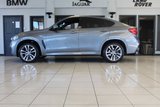 USED 2018 68 BMW X6 3.0 XDRIVE30D M SPORT 4d AUTO 255 BHP FINISHED IN STUNNING METALLIC GREY WITH ELECTRICALLY ADJUSTABLE FULL BLACK LEATHER HEATED SEATS WITH MEMORY PACK PLUS LUMBAR SUPPORT + 1 OWNER FROM NEW WITH A FULLY DOCUMENTED BMW MAIN DEALER SERVICE HISTORY AND THE BALANCE OF BMW'S MANUFACTURERS WARRANTY UNTIL OCTOBER 2021 + PROFESSIONAL SATELLITE NAVIGATION AND MEDIA + DRIVING ASSISTANT + DAB DIGITAL RADIO + BLUETOOTH MEDIA + HARMON KARDON SURROUND SOUND SYSTEM + HEATED FRONT AND REAR SEATS + HEAD UP DISPLAY + VOICE COMMAND + 360 VIEW CAMERA