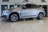 USED 2018 68 BMW X6 3.0 XDRIVE30D M SPORT 4d AUTO 255 BHP FINISHED IN STUNNING METALLIC GREY WITH ELECTRICALLY ADJUSTABLE FULL BLACK LEATHER HEATED SEATS WITH MEMORY PACK PLUS LUMBAR SUPPORT + 1 OWNER FROM NEW WITH A FULLY DOCUMENTED BMW MAIN DEALER SERVICE HISTORY AND THE BALANCE OF BMW'S MANUFACTURERS WARRANTY UNTIL OCTOBER 2021 + PROFESSIONAL SATELLITE NAVIGATION AND MEDIA + DRIVING ASSISTANT + DAB DIGITAL RADIO + BLUETOOTH MEDIA + HARMON KARDON SURROUND SOUND SYSTEM + HEATED FRONT AND REAR SEATS + HEAD UP DISPLAY + VOICE COMMAND + 360 VIEW CAMERA