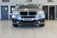 USED 2018 68 BMW X6 3.0 XDRIVE30D M SPORT 4d AUTO 255 BHP FINISHED IN STUNNING METALLIC GREY WITH ELECTRICALLY ADJUSTABLE FULL BLACK LEATHER HEATED SEATS WITH MEMORY PACK PLUS LUMBAR SUPPORT + 1 OWNER FROM NEW WITH A FULLY DOCUMENTED BMW MAIN DEALER SERVICE HISTORY AND THE BALANCE OF BMW'S MANUFACTURERS WARRANTY UNTIL OCTOBER 2021 + PROFESSIONAL SATELLITE NAVIGATION AND MEDIA + DRIVING ASSISTANT + DAB DIGITAL RADIO + BLUETOOTH MEDIA + HARMON KARDON SURROUND SOUND SYSTEM + HEATED FRONT AND REAR SEATS + HEAD UP DISPLAY + VOICE COMMAND + 360 VIEW CAMERA