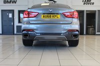 USED 2018 68 BMW X6 3.0 XDRIVE30D M SPORT 4d AUTO 255 BHP FINISHED IN STUNNING METALLIC GREY WITH ELECTRICALLY ADJUSTABLE FULL BLACK LEATHER HEATED SEATS WITH MEMORY PACK PLUS LUMBAR SUPPORT + 1 OWNER FROM NEW WITH A FULLY DOCUMENTED BMW MAIN DEALER SERVICE HISTORY AND THE BALANCE OF BMW'S MANUFACTURERS WARRANTY UNTIL OCTOBER 2021 + PROFESSIONAL SATELLITE NAVIGATION AND MEDIA + DRIVING ASSISTANT + DAB DIGITAL RADIO + BLUETOOTH MEDIA + HARMON KARDON SURROUND SOUND SYSTEM + HEATED FRONT AND REAR SEATS + HEAD UP DISPLAY + VOICE COMMAND + 360 VIEW CAMERA