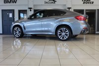 USED 2018 68 BMW X6 3.0 XDRIVE30D M SPORT 4d AUTO 255 BHP FINISHED IN STUNNING METALLIC GREY WITH ELECTRICALLY ADJUSTABLE FULL BLACK LEATHER HEATED SEATS WITH MEMORY PACK PLUS LUMBAR SUPPORT + 1 OWNER FROM NEW WITH A FULLY DOCUMENTED BMW MAIN DEALER SERVICE HISTORY AND THE BALANCE OF BMW'S MANUFACTURERS WARRANTY UNTIL OCTOBER 2021 + PROFESSIONAL SATELLITE NAVIGATION AND MEDIA + DRIVING ASSISTANT + DAB DIGITAL RADIO + BLUETOOTH MEDIA + HARMON KARDON SURROUND SOUND SYSTEM + HEATED FRONT AND REAR SEATS + HEAD UP DISPLAY + VOICE COMMAND + 360 VIEW CAMERA