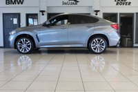 USED 2018 68 BMW X6 3.0 XDRIVE30D M SPORT 4d AUTO 255 BHP FINISHED IN STUNNING METALLIC GREY WITH ELECTRICALLY ADJUSTABLE FULL BLACK LEATHER HEATED SEATS WITH MEMORY PACK PLUS LUMBAR SUPPORT + 1 OWNER FROM NEW WITH A FULLY DOCUMENTED BMW MAIN DEALER SERVICE HISTORY AND THE BALANCE OF BMW'S MANUFACTURERS WARRANTY UNTIL OCTOBER 2021 + PROFESSIONAL SATELLITE NAVIGATION AND MEDIA + DRIVING ASSISTANT + DAB DIGITAL RADIO + BLUETOOTH MEDIA + HARMON KARDON SURROUND SOUND SYSTEM + HEATED FRONT AND REAR SEATS + HEAD UP DISPLAY + VOICE COMMAND + 360 VIEW CAMERA