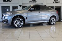 USED 2018 68 BMW X6 3.0 XDRIVE30D M SPORT 4d AUTO 255 BHP FINISHED IN STUNNING METALLIC GREY WITH ELECTRICALLY ADJUSTABLE FULL BLACK LEATHER HEATED SEATS WITH MEMORY PACK PLUS LUMBAR SUPPORT + 1 OWNER FROM NEW WITH A FULLY DOCUMENTED BMW MAIN DEALER SERVICE HISTORY AND THE BALANCE OF BMW'S MANUFACTURERS WARRANTY UNTIL OCTOBER 2021 + PROFESSIONAL SATELLITE NAVIGATION AND MEDIA + DRIVING ASSISTANT + DAB DIGITAL RADIO + BLUETOOTH MEDIA + HARMON KARDON SURROUND SOUND SYSTEM + HEATED FRONT AND REAR SEATS + HEAD UP DISPLAY + VOICE COMMAND + 360 VIEW CAMERA
