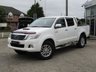 USED 2013 13 TOYOTA HI-LUX 3.0 INVINCIBLE 4X4 D-4D DCB 169 BHP Finished in WHITE with GREY CLOTH TRIM. This refined and rugged and very clean HI-LUX is the complete pick-up package. It is stylish, practical and capable of hauling huge loads. Features include, NO VAT,  Side Bars, Cruise Control, Rear View Camera, B/Tooth and much more. 12 Months MOT.
