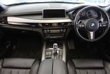 USED 2016 66 BMW X5 3.0 XDRIVE30D M SPORT 5d AUTO 255 BHP FINISHED IN STUNNING SPACE GREY METALLIC, COMPLIMENTED WITH BLACK LEATHER HEATED FRONT & REAR SEAT, ELECTRICALLY ADJUSTABLE SEATS WITH MEMORY PROGRAM + HUGE SPECIFICATION 7 SEATER, COMES WITH A FULL SERVICE HISTORY + ELECTRIC PANORAMIC GLASS SUNROOF + M SPORT PLUS PACKAGE + 360 DEGREE SURROUND VIEW + REAR VIEW CAMERA + LIGHT PACKAGE + PROFESSIONAL SATELLITE NAVIGATION + HEAD UP DISPLAY + FRONT AND REAR PARKING SENSORS + UPGRADED SOUND SYSTEM HARMAN/KARDON + BLUETOOTH PHONE AND MEDIA CONNECTIVITY