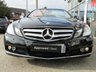 USED 2010 10 MERCEDES-BENZ E-CLASS 1.8 E250 CGI BLUEEFFICIENCY SE 2d 204 BHP Finished in OBSIDIAN BLACK with HEATED LEATHER trim. This CONVERTIBLE is well serviced with low mileage. This is an astonishing car in so many ways, not only is it a great medium family cab with loads of extras, it is also an eye catching sporty looking convertible. Features include Sat Nav, Heated Memory Leather seats, Neck Scarf, Cruise, Park Sensors and 17" Alloys . Dealer serviced at 5815 miles, 10935 miles, 22281 miles, 30437 miles, 33395 miles and on arrival at 37838 miles.