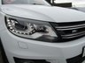 USED 2015 65 VOLKSWAGEN TIGUAN 2.0 R LINE EDITION TDI BMT 4MOTION DSG 5d 181 BHP Finished in PURE WHITE with contrasting HEATED EBONY LEATHER trim. This high spec Tiguan has a more sophisticated look to add to its high quality interior and high spec. Features include, Full Heated Leather, Sat Nav, DAB Radio, 19" ALLOYS, Auto Parking, Cruise control, Keyless Start, Front and Rear Park Sensors and much more. Dealer serviced at 6477 miles, 13821 miles, 19527 miles, 29132 miles, 32847 miles (Cam Belt and Water Pump) and at 38634 miles. MOT due 26/7/2022.