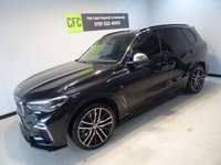 USED 2019 68 BMW X5 3.0 M50D 5d 395 BHP THIS INCREDIBLE SPORTS UTILITY VEHICLE COMES IN GLEAMING BLACK, IT IS THE EPITOME OF COMFORT, STYLE AND POWER, IT HAS AN AMAZING SET OF FEATURES INCLUDING 22" M ALLOY WHEELS, BMW DIGITAL PRO LIVE COCKPIT, SKY LOUNGE PANORAMIC SUNROOF, 3D PARKING CAMERA WITH PARK ASSIST, 12.3" SAT NAV, MEDIA INTERFACE SCREEN WITH BLUETOOTH AUDIO CONNECTION, 20GB HDD AND DAB RADIO, HARMON/KARDON SOUND SYSTEM, APPLE CAR PLAY, GESTURE CONTROL, HEATED LEATHER ELECTRIC ADJUST MEMORY SEATS, HEATED & COOLED CUP HOLDERS,