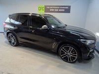 USED 2019 68 BMW X5 3.0 M50D 5d 395 BHP THIS INCREDIBLE SPORTS UTILITY VEHICLE COMES IN GLEAMING BLACK, IT IS THE EPITOME OF COMFORT, STYLE AND POWER, IT HAS AN AMAZING SET OF FEATURES INCLUDING 22" M ALLOY WHEELS, BMW DIGITAL PRO LIVE COCKPIT, SKY LOUNGE PANORAMIC SUNROOF, 3D PARKING CAMERA WITH PARK ASSIST, 12.3" SAT NAV, MEDIA INTERFACE SCREEN WITH BLUETOOTH AUDIO CONNECTION, 20GB HDD AND DAB RADIO, HARMON/KARDON SOUND SYSTEM, APPLE CAR PLAY, GESTURE CONTROL, HEATED LEATHER ELECTRIC ADJUST MEMORY SEATS, HEATED & COOLED CUP HOLDERS,