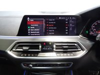 USED 2019 68 BMW X5 3.0 M50D 5d 395 BHP THIS INCREDIBLE SPORTS UTILITY VEHICLE COMES IN GLEAMING BLACK, IT IS THE EPITOME OF COMFORT, STYLE AND POWER, IT HAS AN AMAZING SET OF FEATURES INCLUDING 22" M ALLOY WHEELS, BMW DIGITAL PRO LIVE COCKPIT, SKY LOUNGE PANORAMIC SUNROOF, 3D PARKING CAMERA WITH PARK ASSIST, 12.3" SAT NAV, MEDIA INTERFACE SCREEN WITH BLUETOOTH AUDIO CONNECTION, 20GB HDD AND DAB RADIO, HARMON/KARDON SOUND SYSTEM, APPLE CAR PLAY, GESTURE CONTROL, HEATED LEATHER ELECTRIC ADJUST MEMORY SEATS, HEATED & COOLED CUP HOLDERS,