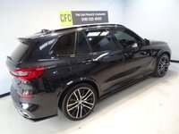 USED 2019 68 BMW X5 3.0 M50D 5d 395 BHP THIS INCREDIBLE SPORTS UTILITY VEHICLE COMES IN GLEAMING BLACK, IT IS THE EPITOME OF COMFORT, STYLE AND POWER, IT HAS AN AMAZING SET OF FEATURES INCLUDING 22" M ALLOY WHEELS, BMW DIGITAL PRO LIVE COCKPIT, SKY LOUNGE PANORAMIC SUNROOF, 3D PARKING CAMERA WITH PARK ASSIST, 12.3" SAT NAV, MEDIA INTERFACE SCREEN WITH BLUETOOTH AUDIO CONNECTION, 20GB HDD AND DAB RADIO, HARMON/KARDON SOUND SYSTEM, APPLE CAR PLAY, GESTURE CONTROL, HEATED LEATHER ELECTRIC ADJUST MEMORY SEATS, HEATED & COOLED CUP HOLDERS,