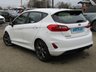 USED 2018 67 FORD FIESTA 1.0 ST-LINE 5d 138 BHP Finished in Frozen White with contrasting GREY Sports Cloth interior trim. This Fiesta is a small family 5 door car that you can really enjoy driving. Economical and cheap to run, stylish to look at and some great features. Specification includes, Sat Nav, B/Tooth, DAB Radio, Rear Park Sensors, Cruise control, Alloys, Air Con and much more, makes this a must for the first time driver or small family. Dealer Serviced at 11831 miles, 22096 miles, 35053 miles and at 49037 miles on 11/01/2022.