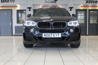 USED 2017 67 BMW X6 3.0 XDRIVE30D M SPORT 4d 255 BHP M SPORT PLUS PACKAGE + PANORAMIC GLASS SUNROOF + DIGITAL DASH DISPLAY + HEAD UP DISPLAY + PROFESSIONAL SATELLITE NAVIGATION + HARMAN KARDON SOUND SYSTEM + ENHANCED BLUETOOTH PHONE PREPARATION WITH WIRELESS CHARGING + REAR VIEW CAMERA + APPS CONTROL + TV FUNCTION + APPLE CARPLAY PREPARATION + AUTOMATIC AIR CONDITIONING +  DUAL ZONE CLIMATE CONTROL + ELECTRICALLY ADJUSTABLE LEATHER MULTIFUNCTIONAL STEERING WHEEL WITH PADDLE SHIFT GEAR SELECT + DAB DIGITAL RADIO + KEYLESS START