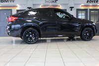 USED 2017 67 BMW X6 3.0 XDRIVE30D M SPORT 4d 255 BHP M SPORT PLUS PACKAGE + PANORAMIC GLASS SUNROOF + DIGITAL DASH DISPLAY + HEAD UP DISPLAY + PROFESSIONAL SATELLITE NAVIGATION + HARMAN KARDON SOUND SYSTEM + ENHANCED BLUETOOTH PHONE PREPARATION WITH WIRELESS CHARGING + REAR VIEW CAMERA + APPS CONTROL + TV FUNCTION + APPLE CARPLAY PREPARATION + AUTOMATIC AIR CONDITIONING +  DUAL ZONE CLIMATE CONTROL + ELECTRICALLY ADJUSTABLE LEATHER MULTIFUNCTIONAL STEERING WHEEL WITH PADDLE SHIFT GEAR SELECT + DAB DIGITAL RADIO + KEYLESS START