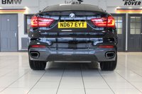 USED 2017 67 BMW X6 3.0 XDRIVE30D M SPORT 4d 255 BHP M SPORT PLUS PACKAGE + PANORAMIC GLASS SUNROOF + DIGITAL DASH DISPLAY + HEAD UP DISPLAY + PROFESSIONAL SATELLITE NAVIGATION + HARMAN KARDON SOUND SYSTEM + ENHANCED BLUETOOTH PHONE PREPARATION WITH WIRELESS CHARGING + REAR VIEW CAMERA + APPS CONTROL + TV FUNCTION + APPLE CARPLAY PREPARATION + AUTOMATIC AIR CONDITIONING +  DUAL ZONE CLIMATE CONTROL + ELECTRICALLY ADJUSTABLE LEATHER MULTIFUNCTIONAL STEERING WHEEL WITH PADDLE SHIFT GEAR SELECT + DAB DIGITAL RADIO + KEYLESS START