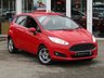 USED 2014 14 FORD FIESTA 1.0 ZETEC 5d 99 BHP Finished in RACE RED with contrasting GREY Cloth interior trim. This Fiesta is a small family 5 door car that you can really enjoy driving. Economical and cheap to run, stylish to look at and some great features. Specification includes, Zero road tax, B/Tooth, Alloys, Air Con, Heated front Screen and much more, makes this a must for the first time driver or small family. Just serviced with 12 months MOT.