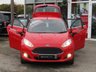 USED 2014 14 FORD FIESTA 1.0 ZETEC 5d 99 BHP Finished in RACE RED with contrasting GREY Cloth interior trim. This Fiesta is a small family 5 door car that you can really enjoy driving. Economical and cheap to run, stylish to look at and some great features. Specification includes, Zero road tax, B/Tooth, Alloys, Air Con, Heated front Screen and much more, makes this a must for the first time driver or small family. Just serviced with 12 months MOT.