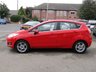 USED 2014 14 FORD FIESTA 1.0 ZETEC 5d 99 BHP Finished in RACE RED with contrasting GREY Cloth interior trim. This Fiesta is a small family 5 door car that you can really enjoy driving. Economical and cheap to run, stylish to look at and some great features. Specification includes, Zero road tax, B/Tooth, Alloys, Air Con, Heated front Screen and much more, makes this a must for the first time driver or small family. Just serviced with 12 months MOT.