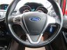USED 2014 14 FORD FIESTA 1.0 ZETEC 5d 99 BHP Finished in RACE RED with contrasting GREY Cloth interior trim. This Fiesta is a small family 5 door car that you can really enjoy driving. Economical and cheap to run, stylish to look at and some great features. Specification includes, Zero road tax, B/Tooth, Alloys, Air Con, Heated front Screen and much more, makes this a must for the first time driver or small family. Just serviced with 12 months MOT.