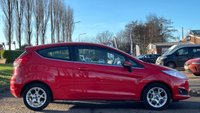 USED 2013 13 FORD FIESTA 1.0 ZETEC 3d 99 BHP THIS CAR COMES WITH 6 MONTHS WARRANTY , BREAKDOWN COVER & RECOVERY++   GOOD SERVICE HISTORY +   FORD SYNC +   BLUETOOTH +  AUX +   USB +   RACE RED EXTERIOR PAINT +   HEATED WINDSCREEN +   CENTER ARMREST AND STORAGE +   SPARE WHEEL +