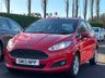USED 2013 13 FORD FIESTA 1.0 ZETEC 3d 99 BHP THIS CAR COMES WITH 6 MONTHS WARRANTY , BREAKDOWN COVER & RECOVERY++   GOOD SERVICE HISTORY +   FORD SYNC +   BLUETOOTH +  AUX +   USB +   RACE RED EXTERIOR PAINT +   HEATED WINDSCREEN +   CENTER ARMREST AND STORAGE +   SPARE WHEEL +