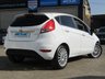 USED 2013 63 FORD FIESTA 1.6 TITANIUM 5d 104 BHP Finished in FROZEN WHITE with contrasting GREY Cloth Trim. This Fiesta is a small family high spec 5 door AUTO car that you can really enjoy driving. Economical and cheap to run, stylish to look at and some great features. Specification includes  DAB Radio, Power Folding Door Mirrors, B/Tooth, Alloys, Air Con, Heated front Screen and much more. Dealer serviced 6986 miles, 14340 miles, 24593 miles, 29597 miles, 35626 miles, 39841 miles, 42361 miles and at 47452 miles.