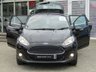 USED 2014 63 FORD FIESTA 1.0 ZETEC 5d 99 BHP Finished in PANTHER BLACK with contrasting SPORTS GREY Cloth interior trim. This Fiesta is a small car that you can really enjoy driving. Economical and cheap to run, stylish to look at and some great features including Zero Road Tax with, B/Tooth, Alloys, Air Con and much more, makes this a must for the first time driver or small family. Dealer Serviced at 2575 miles, 5562 miles, 6542 miles, 10333 miles, 15190 miles, 22965 miles and on arrival at 37185 miles.