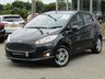 USED 2014 63 FORD FIESTA 1.0 ZETEC 5d 99 BHP Finished in PANTHER BLACK with contrasting SPORTS GREY Cloth interior trim. This Fiesta is a small car that you can really enjoy driving. Economical and cheap to run, stylish to look at and some great features including Zero Road Tax with, B/Tooth, Alloys, Air Con and much more, makes this a must for the first time driver or small family. Dealer Serviced at 2575 miles, 5562 miles, 6542 miles, 10333 miles, 15190 miles, 22965 miles and on arrival at 37185 miles.