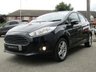 USED 2014 63 FORD FIESTA 1.0 ZETEC 5d 99 BHP Finished in PANTHER BLACK with contrasting SPORTS GREY Cloth interior trim. This Fiesta is a small car that you can really enjoy driving. Economical and cheap to run, stylish to look at and some great features including Zero Road Tax with, B/Tooth, Alloys, Air Con and much more, makes this a must for the first time driver or small family. Dealer Serviced at 2575 miles, 5562 miles, 6542 miles, 10333 miles, 15190 miles, 22965 miles and on arrival at 37185 miles.