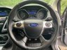 USED 2013 13 FORD FOCUS 1.0 TITANIUM X 5d 99 BHP ULEZ COMPLIANT - This isn't just any Ford Focus; it's the Titanium X trim, the pinnacle of the range, and it comes with an exciting Micastone Metallic finish that turns heads wherever it goes. With a combined MPG of 58.9, this car delivers not only style but also impressive efficiency.