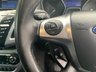 USED 2013 13 FORD FOCUS 1.0 TITANIUM X 5d 99 BHP ULEZ COMPLIANT - This isn't just any Ford Focus; it's the Titanium X trim, the pinnacle of the range, and it comes with an exciting Micastone Metallic finish that turns heads wherever it goes. With a combined MPG of 58.9, this car delivers not only style but also impressive efficiency.