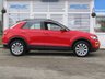 USED 2019 69 VOLKSWAGEN T-ROC 1.5 SE TSI EVO DSG 5d 148 BHP Finished in FLASH RED with contrasting Sports Trim. This T-Roc is for those who want a compact SUV with smart styling and a good level of practicality. This Golf based SUV is both practical and fun to drive. Features include, Sat Nav, Apple Play, 17" Alloys, Heated Seats, DAB Radio, Power rear boot, Cruise Control, B/Tooth and much more. VW Dealer serviced at 20006 miles, 38263 miles and at 57801 miles.